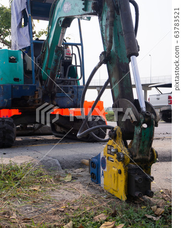 Road works building site excavator and worker Road works building site excavator and worker 63783521