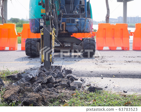 Road works building site excavator and worker Road works building site excavator and worker 63783523