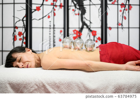 Traditional Chinese Medicine therapy. Cupping therapy, a treatment used for pain relief and other Traditional Chinese Medicine therapy. Cupping therapy, a treatment used for pain relief and other 63784975