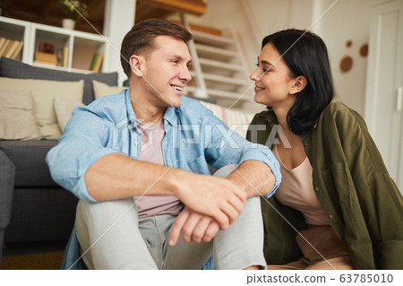 Happy Couple Enjoying Time at Home Happy Couple Enjoying Time at Home 63785010