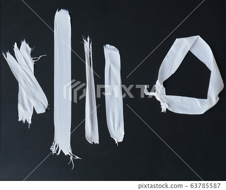 Different pieces of white plumber tape 63785587