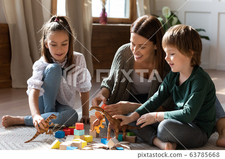 Mom enjoying spending free leisure weekend time with two kids. Mom enjoying spending free leisure weekend time with two kids. 63785668