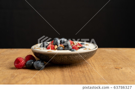 Tasty fresh blueberry raspberries yoghurt shake 63786327