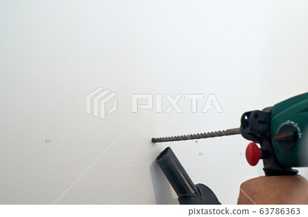 Drilling a hole Drilling a hole 63786363