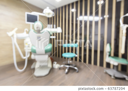 Blurred stomatology interior of children dental clinic Blurred stomatology interior of children dental clinic 63787204