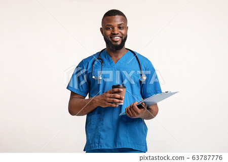 Happy black doctor with medical chart having coffee break 63787776