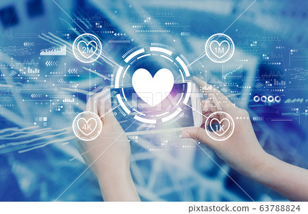 Get more likes concept with person using smartphone Get more likes concept with person using smartphone 63788824