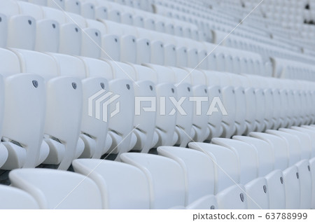 Empty white seats at the american football stadium during isolation period Empty white seats at the american football stadium during isolation period 63788999