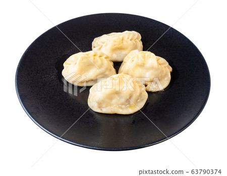 cooked Manti on black plate isolated on white 63790374