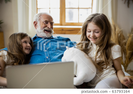 Positive family with toys and laptop stock photo 63793164