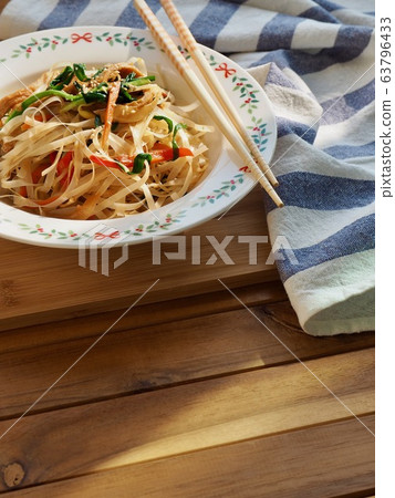 Asian food stir-fried rice noodles with vegetables 63796433