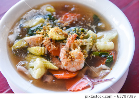 Thick Gravy seafood noodles with squid shrimp Thick Gravy seafood noodles with squid shrimp 63797389