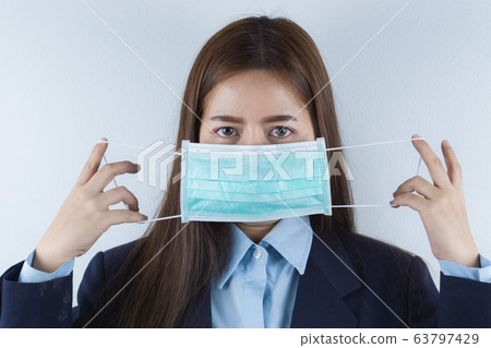 The business woman wearing protection face mask The business woman wearing protection face mask 63797429