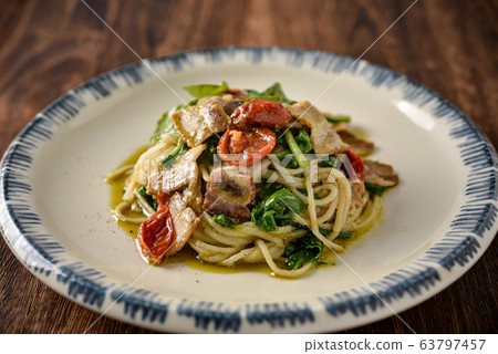 Organic pasta with organic cherry tomatoes and organic arugula 63797457