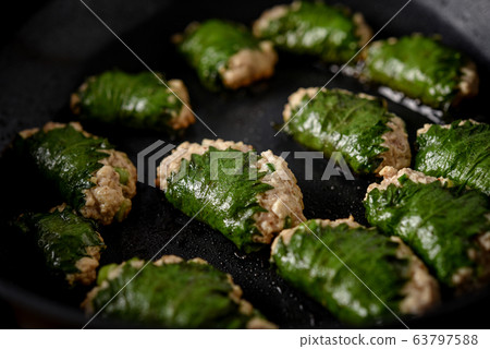 Simple healthy dumplings wrapped in large leaves Simple healthy dumplings wrapped in large leaves 63797588