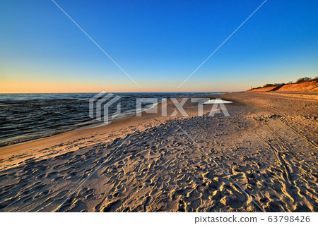 Sunset at Baltic sea and nordic dunes of Curonian spit, Nida, Lithuania 63798426