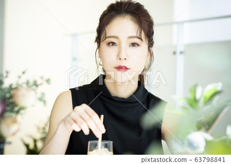 Young woman, cafe, ice tea Young woman, cafe, ice tea 63798841