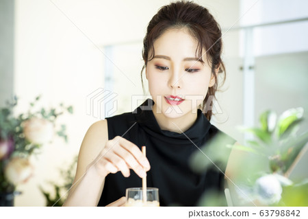 Young woman, cafe, ice tea Young woman, cafe, ice tea 63798842