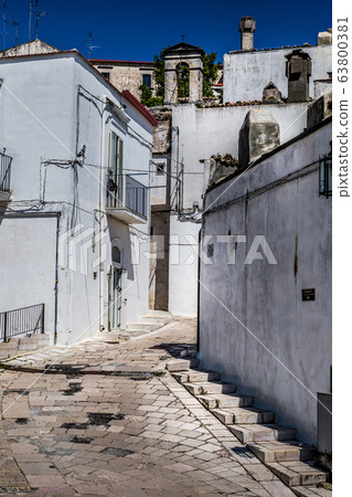 Narrow streets and stairs lined with white houses Narrow streets and stairs lined with white houses 63800381