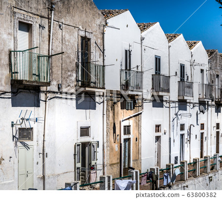 Narrow streets and stairs lined with white houses Narrow streets and stairs lined with white houses 63800382