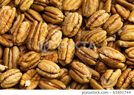 Pecan nuts background. Closeup pekan seeds 63801744