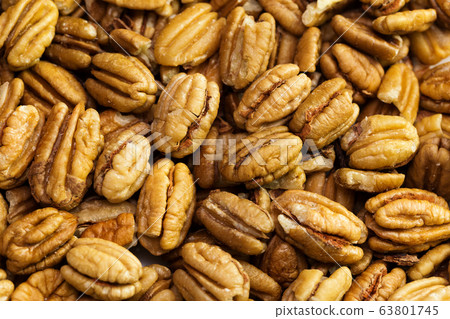 Pecan nuts background. Closeup pekan seeds 63801745