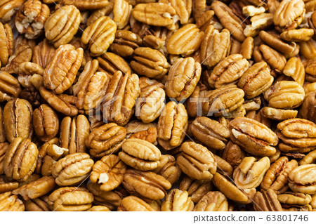 Pecan nuts background. Closeup pekan seeds 63801746