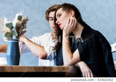 Couple drinking coffee laughing in cafe Couple drinking coffee laughing in cafe 63802082