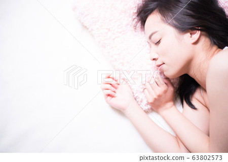 woman sleeping in bed woman sleeping in bed 63802573