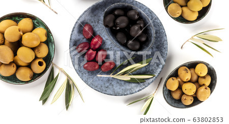 Olives overhead panorama on a white background. Green, black and red olives, shot from above 63802853