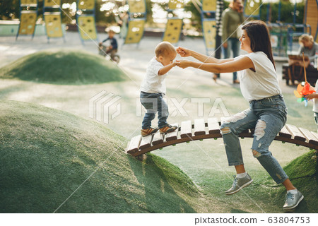 Mother with little child on a playground Mother with little child on a playground 63804753