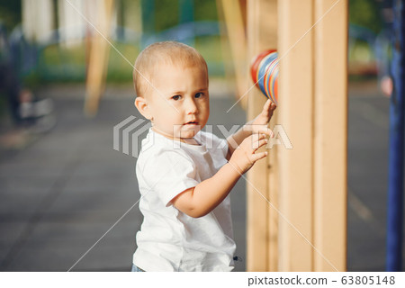 Cute little boy have fun on a playground Cute little boy have fun on a playground 63805148