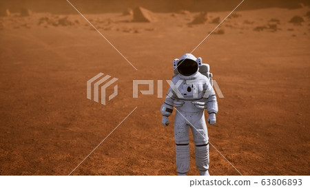 Astronaut on Mars Surface. Red Planet Covered in Astronaut on Mars Surface. Red Planet Covered in 63806893