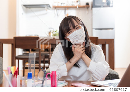 A young woman with a mask 63807617