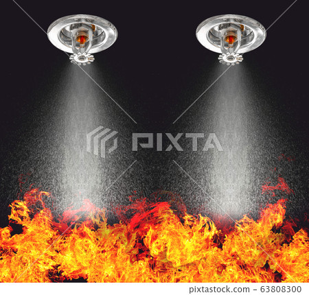 Image of Fire Sprinklers Spraying with fire background. Fire sprinklers are part of an overall safety protocol for fire and life safety. 63808300