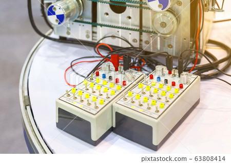 Automatic electrical connector switch in power lines of inverter controller drive located inside of an industrial switch control panel board. Automatic electrical connector switch in power lines of inverter controller drive located inside of an industrial switch control panel board. 63808414