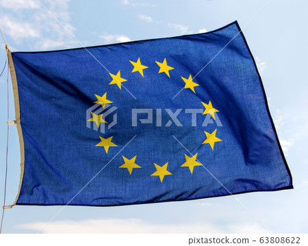 Flag of the European Union flutters on the blue 63808622
