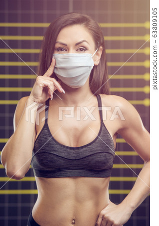 Fitness woman with coronavirus disease COVID-19 63809105