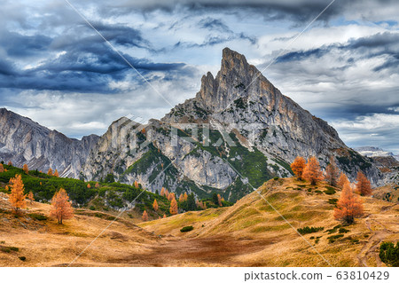 Autumn landscape of mountains over blue sky 63810429