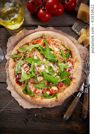 Pizza with prosciutto ham, walnuts, gorgonzola 63810622