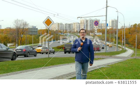 Journalist with microphone Journalist with microphone 63811555