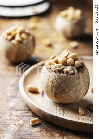Salt peanut on the wooden table 63813024
