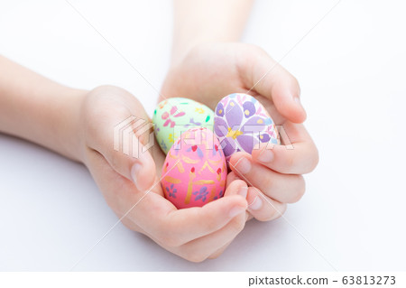 Handmade Easter eggs-riding on the child's palm Handmade Easter eggs-riding on the child's palm 63813273