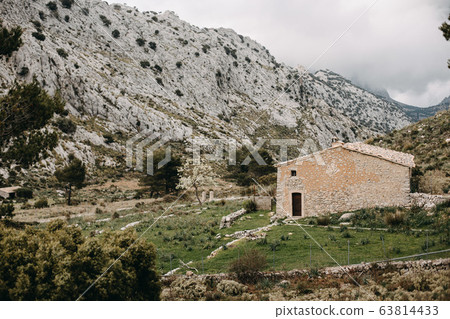 wide scenic mountain landscape with cloudy sky 63814433