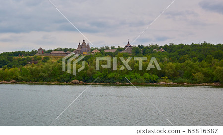 Wooden buildings. Wooden houses of Cossacks. Outbuildings at Zaporizhzhya Sich on island of Khortytsya in Ukraine. Medieval way of life 63816387
