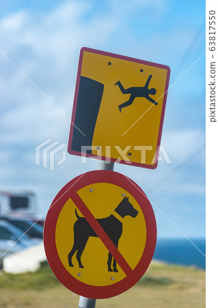 Icelandic sign no dogs and you can fall from cliff. Latrabjarg 63817550
