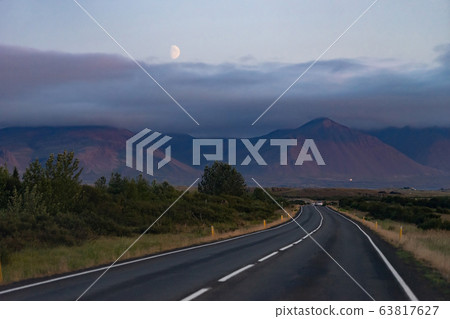 Scenic night landscape with beautiful road, moon and mountains from Iceland Westfjord Scenic night landscape with beautiful road, moon and mountains from Iceland Westfjord 63817627