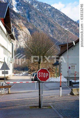 Sign Stop on empty parking in small historical village Hallstatt. It`s most popular, romance and dream of destination for many tourists. 63818246