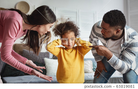 Parents scolds child. Girl closed her ears and eyes 63819081