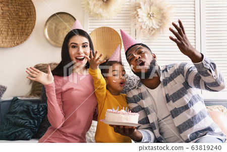 International family in caps smeared in cake 63819240